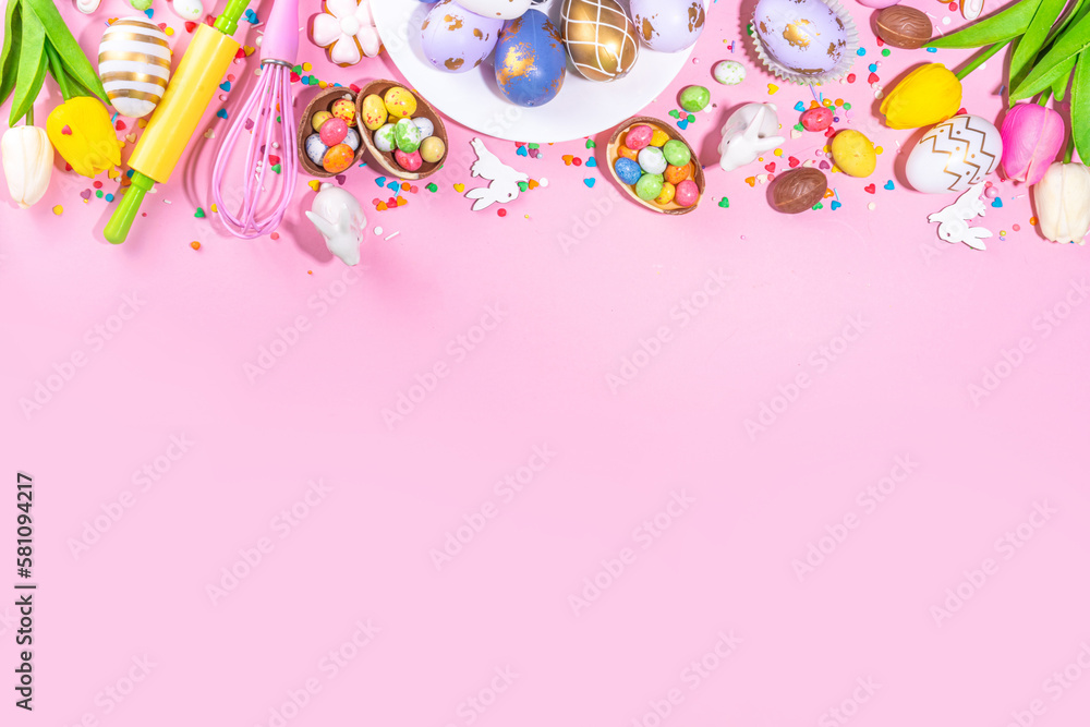 High-colored Easter baking background, Easter sale, party invitation flaylay, Colorful Easter eggs, chocolate eggs and bunny rabbit with sugar sprinkles on bright pink background top view copy space High-colored Easter baking background, Easter sale, party invitation flaylay, Colorful Easter eggs, chocolate eggs and bunny rabbit with sugar sprinkles on bright pink background top view copy space