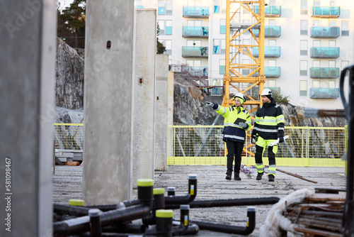 Construction engineers working at construction site