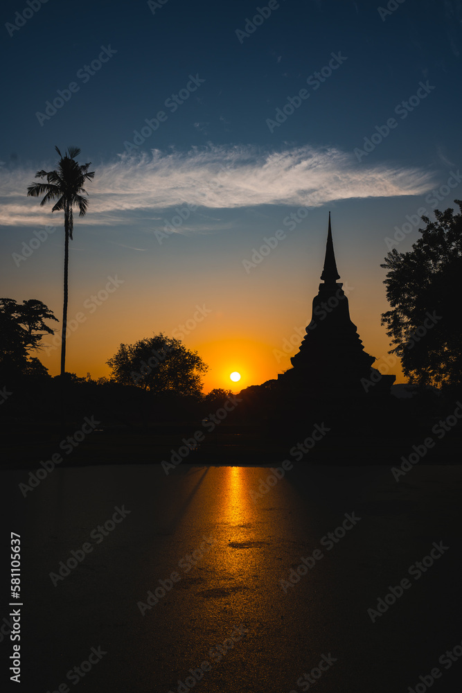 Historic Town of Sukhothai temple park, Ancient Buddha Statue at sunset Sukhothai historical park, Mahathat Temple
