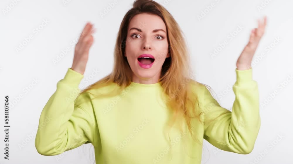 Surprised young woman hands up wonder, shocked. Wow! Blonde lady amazed excited by success, win, surprise emotion. Oh my god expression! Indoor studio shot isolated on white background Surprised young woman hands up wonder, shocked. Wow! Blonde lady amazed excited by success, win, surprise emotion. Oh my god expression! Indoor studio shot isolated on white background