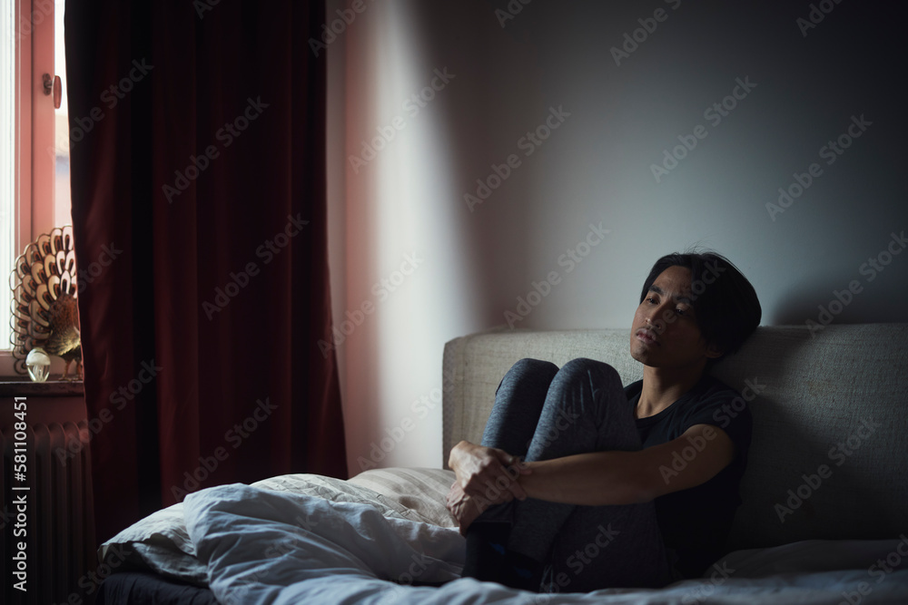 Pensive man sitting on sofa Pensive man sitting on sofa