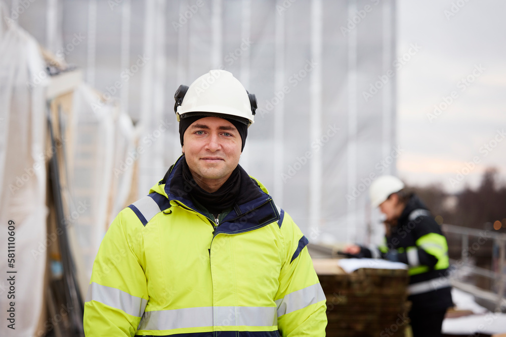 Engineer standing at building site Engineer standing at building site