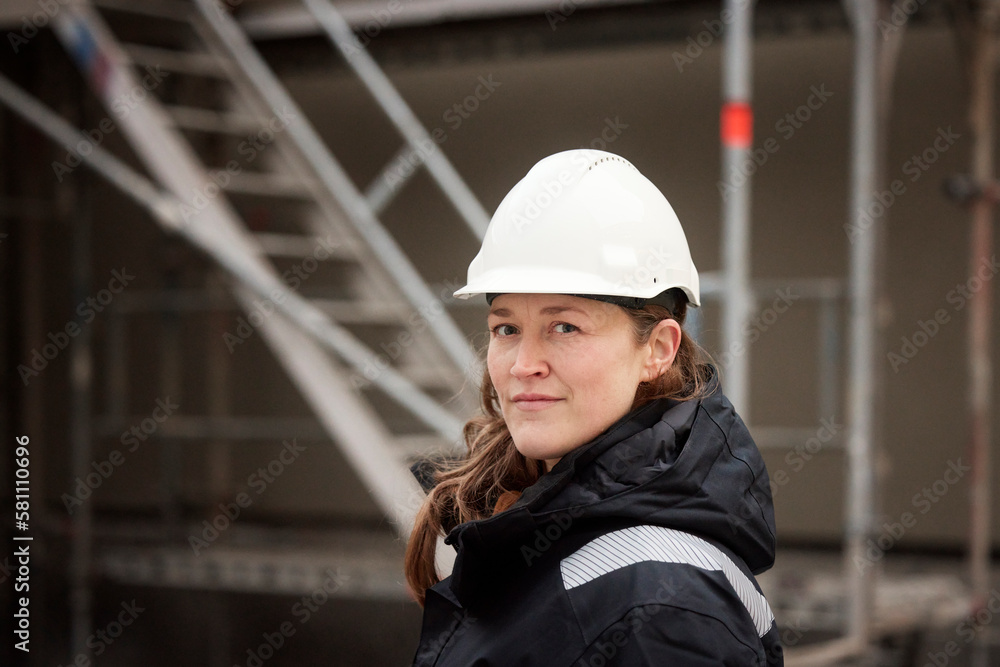 Female engineer standing at building site Female engineer standing at building site