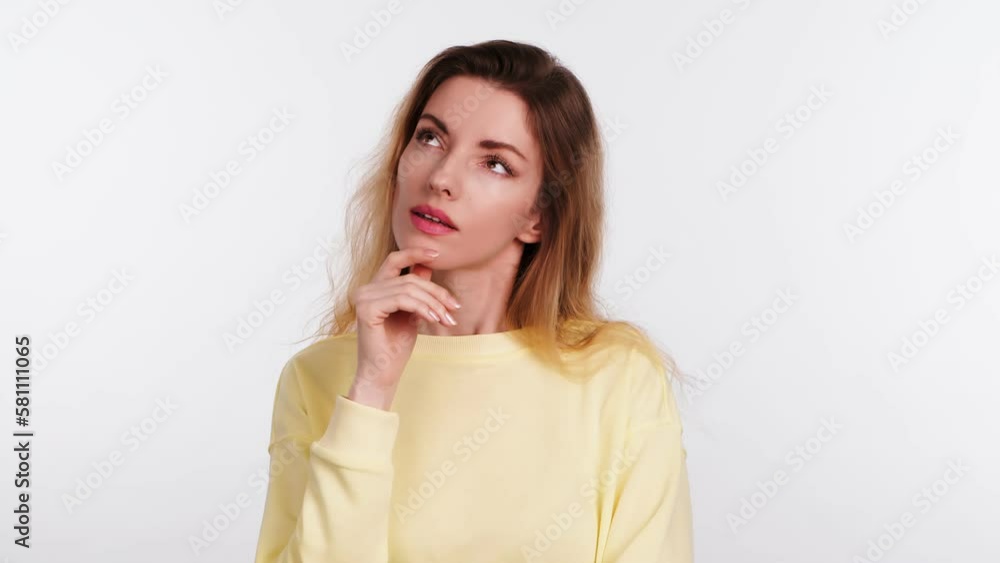 Thoughtful woman pointing finger up, idea emotion, looks up and around, pensive expression makes a decision. Clever lady pondering a solution, confusion thinking. Indoors studio shot isolated on white Thoughtful woman pointing finger up, idea emotion, looks up and around, pensive expression makes a decision. Clever lady pondering a solution, confusion thinking. Indoors studio shot isolated on white