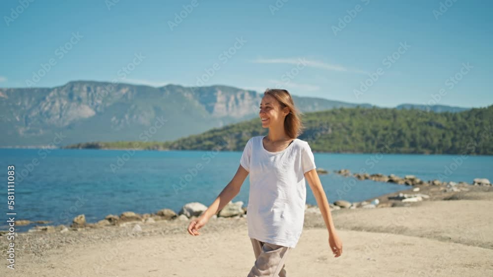 beautiful slender sporty woman traveler walks on rocky shore of beautiful sea bay with clear calm turquoise water and paradise empty sea beach. slow motion 4k, summertime travel in western Turkey beautiful slender sporty woman traveler walks on rocky shore of beautiful sea bay with clear calm turquoise water and paradise empty sea beach. slow motion 4k, summertime travel in western Turkey