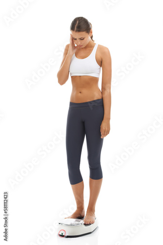 Working towards the body of her dreams...Studio shot of a sporty young woman isolated on white.