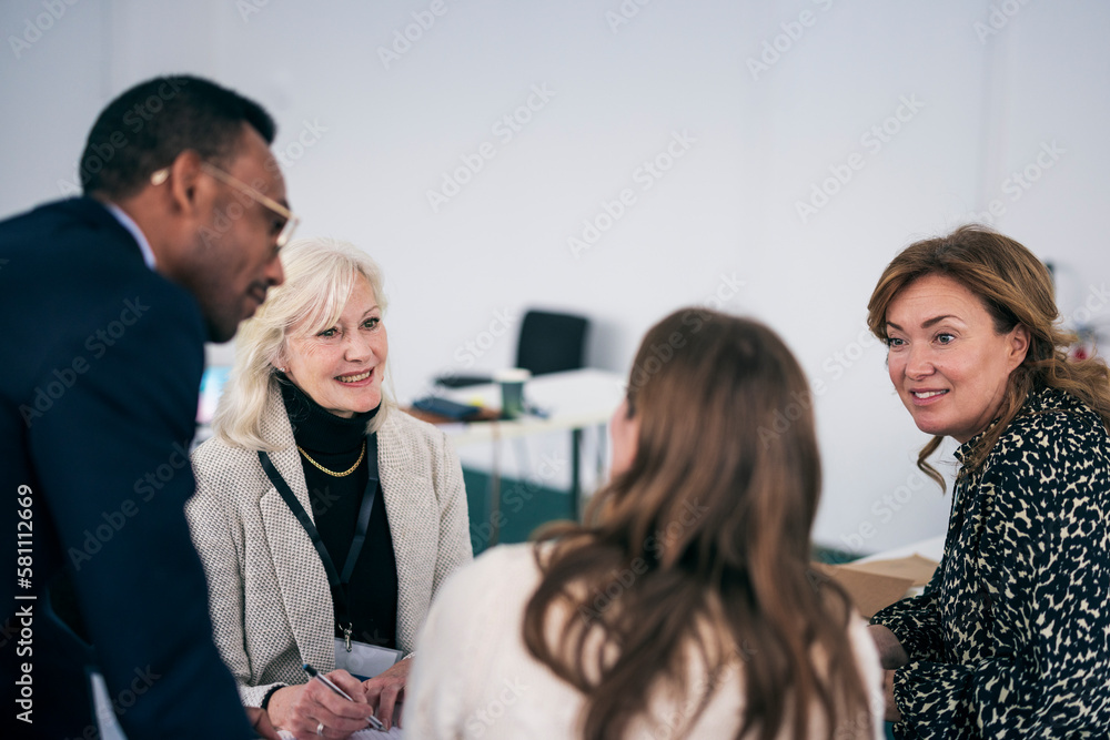 Group of people having business seminar Group of people having business seminar