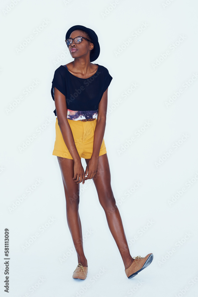 Fototapeta premium Her style is unique and all her own. An african american hipster posing in the studio.