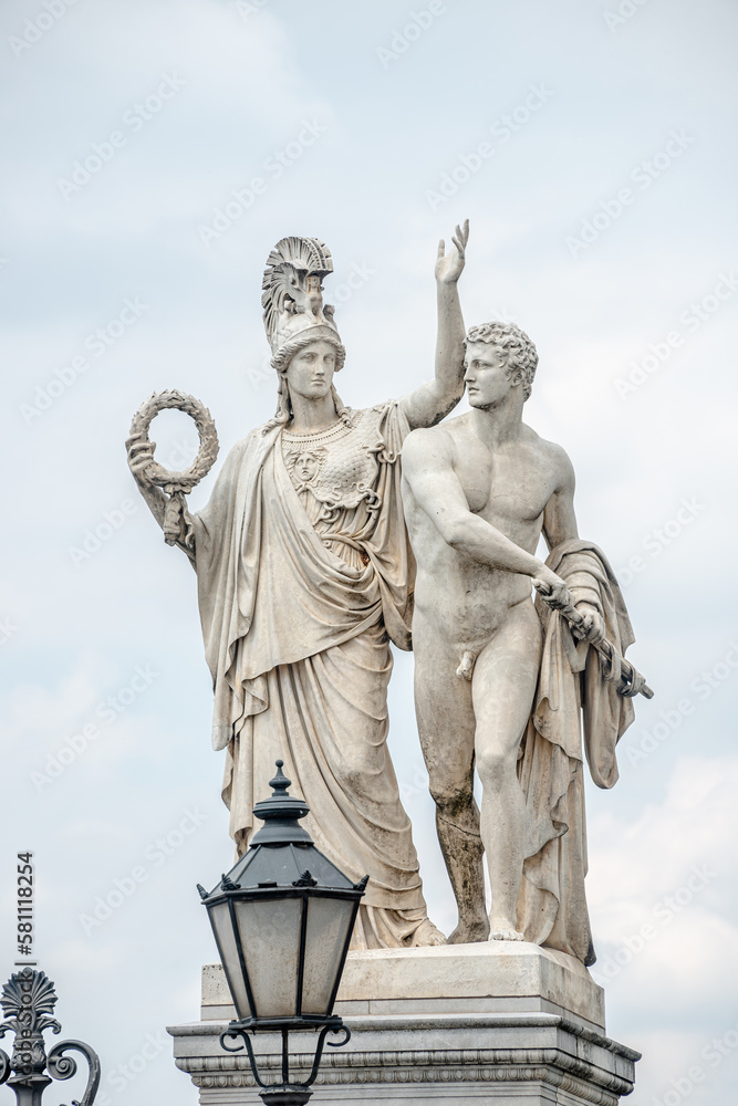 Berlin, Germany - June 8, 2021: View at Roman statues in the ancient Castle Bridge near Berlin Cathedral and Unter den Linden street in historical and museum downtown of Berlin