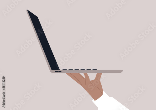 A hand holding a laptop as a tray