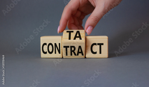 Contact and Contract symbol. Businessman hand turns wooden cubes and changes the word Contract to Contact. Beautiful grey background. Contact and Contract and business concept. Copy space