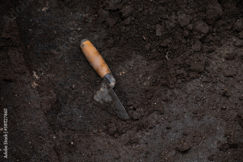 trowel on the ground in an archaeological excavation