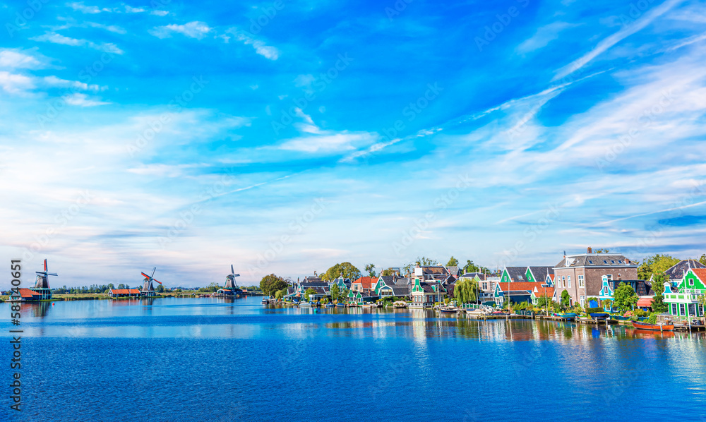 Zaandijk, Netherlands. Panorama of traditional dutch houses at the Zaan river in Zaandijk, Netherlands.