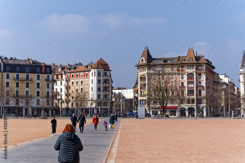 Red square named Plaine de Plainpalais at Swiss City of Geneva with pedestrians enjoying Sunday on a sunny late winter day. Photo taken March 5th, 2023, Geneva, Switzerland.