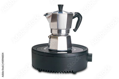 Side view of italian moka pot coffee maker heating on electric strove isolated on white background with clipping path