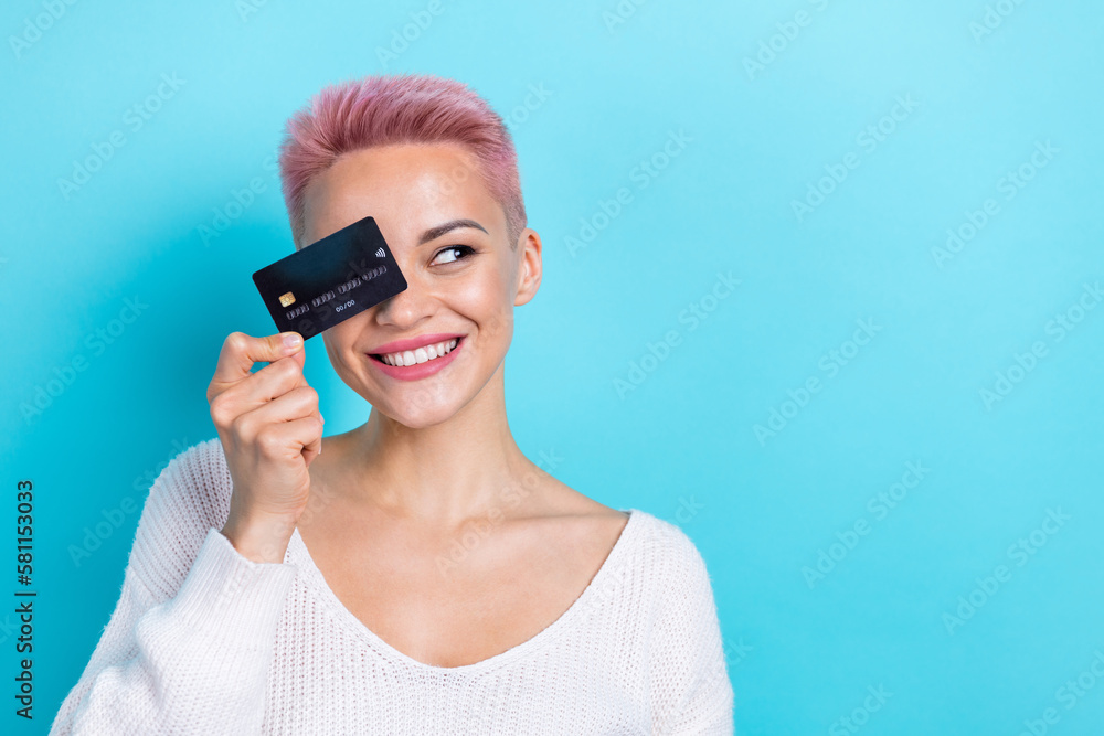 Photo of cheerful charming lady wear stylish clothes hold card interesting news proposition empty space isolated on blue color background Photo of cheerful charming lady wear stylish clothes hold card interesting news proposition empty space isolated on blue color background