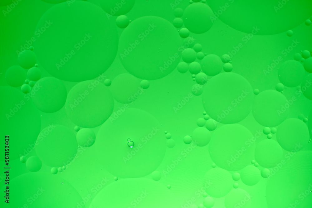 Abstract background with green oil circles on the water. Abstract background with green oil circles on the water.