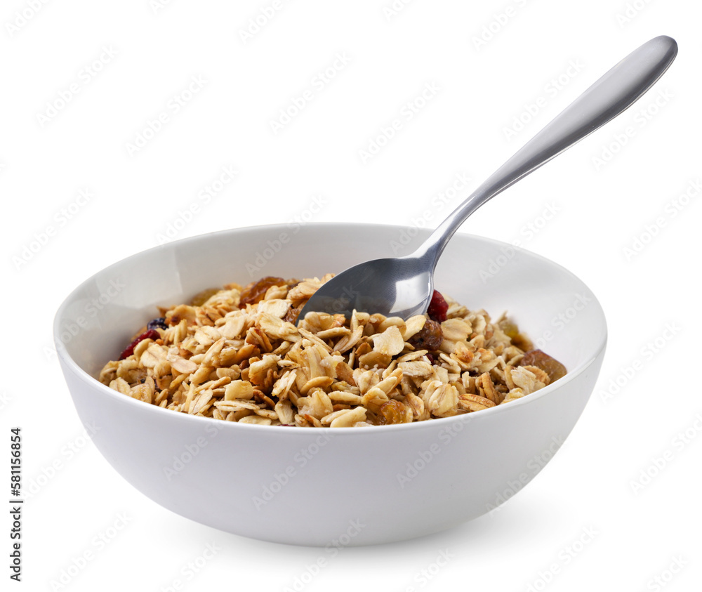 Muesli in a plate with a spoon on a white background. Isolated Muesli in a plate with a spoon on a white background. Isolated