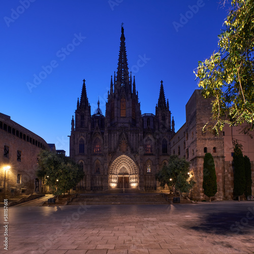 Dark cathedral on main square in the evening in Barcelona, Spain