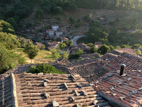 a view from a very high point looking down at houses and roofs photo