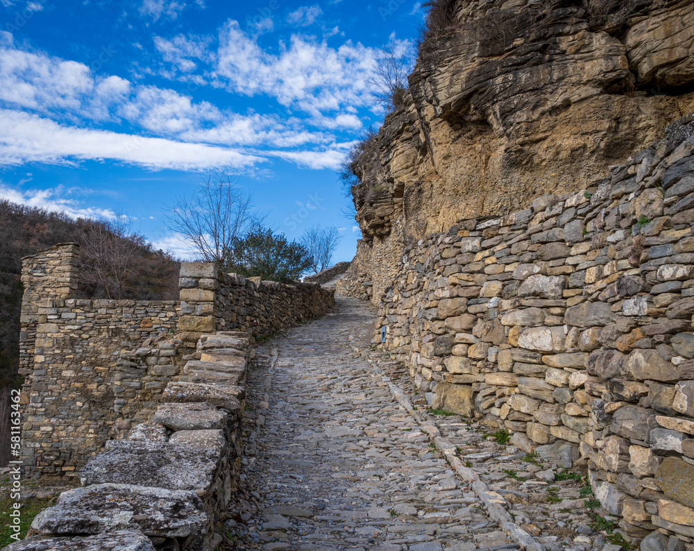 montanana huesca aragon spain path with stone wall and old collapsed stone house