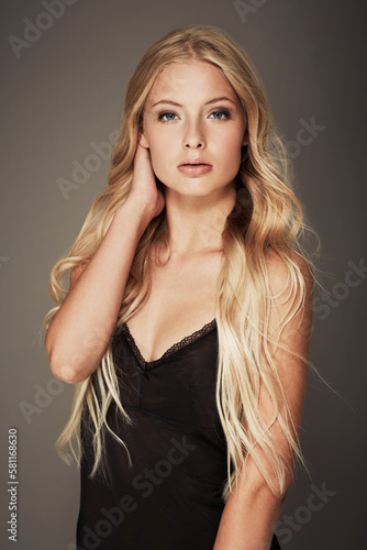 Her confidence is beautiful. Portrait of an attractive and young woman posing in the studio.