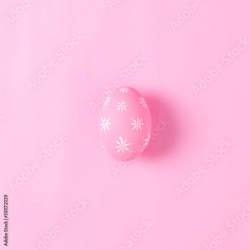 Happy Easter holiday greeting card concept. Pink Easter Eggs on pastel pink background. Flat lay, top view, copy space.