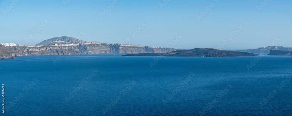 Wide panoramic view of Santorini caldera seen from Oia town, Greece