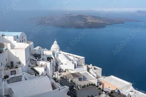 Main village of Santorini, Fira at sunset. Fira with whitewashed typical buildings, Greece