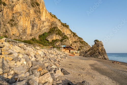 Image of a beach during sunset near Marina di Camerota on Cilento coastline, Campania region, Italy photo