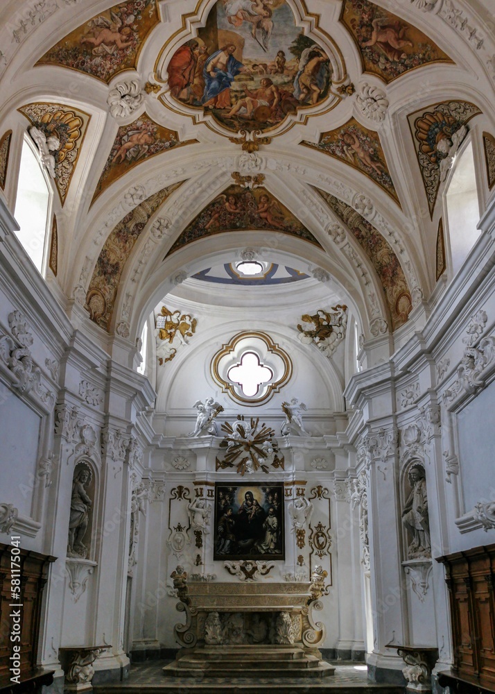 Vertical image of a monastery with paintings and statues in Baroque style in Certosa di Padula