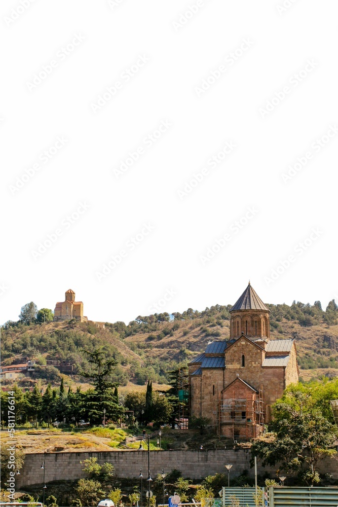 Vertical shot of the Metekhi St. Virgin church on the hill in Tbilisi, Georgia