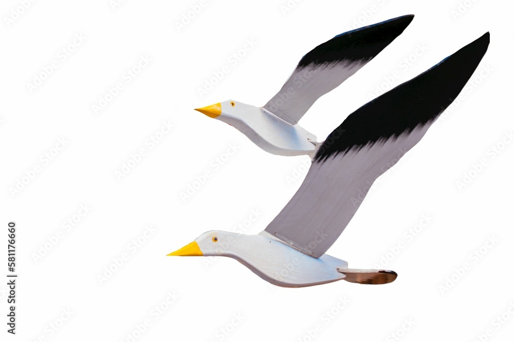 Handmade seagull figures flying isolated on a white background Handmade seagull figures flying isolated on a white background