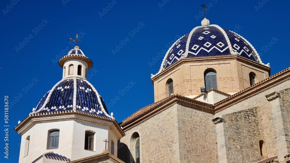 Virgin of the Consol church in Altea, Spain
 against a backdrop of the blue sky