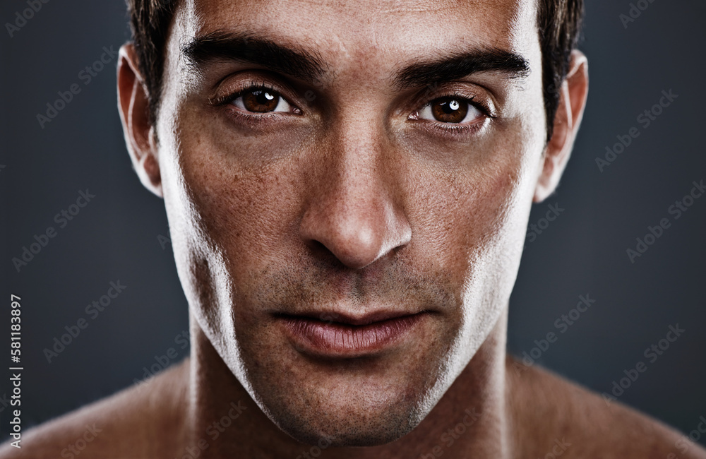 Fototapeta premium He just oozes confidence. Closeup studio portrait of a handsome young man.