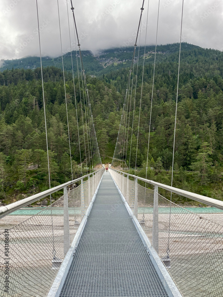 Obraz premium A suspension bridge over lech river in austria