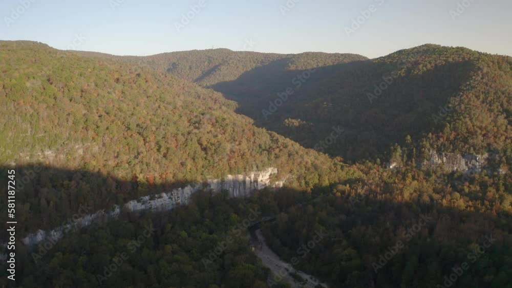 Aerial view of fall foliage valley landscape in northwest Arkansas with tall bluffs and river during autumn season at sunrise - 4K Drone Aerial view of fall foliage valley landscape in northwest Arkansas with tall bluffs and river during autumn season at sunrise - 4K Drone