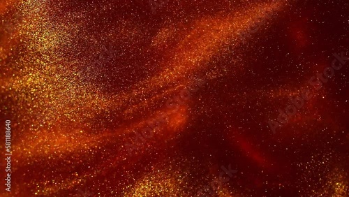 Golden Particles Motion In Red Fluid. Abstract Moving particles of gold dust on red. Romantic or New Year's Eve luxe background. Floating Golden particles.