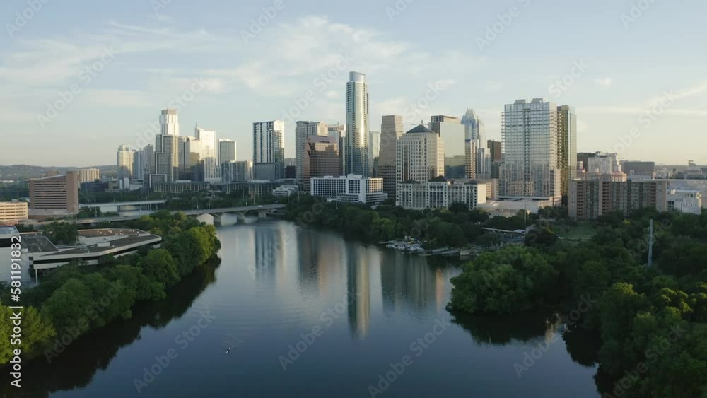 Revealing aerial view of Colorado River and downtown Austin, Texas skyline during sunrise morning landscape - 4K Drone Revealing aerial view of Colorado River and downtown Austin, Texas skyline during sunrise morning landscape - 4K Drone