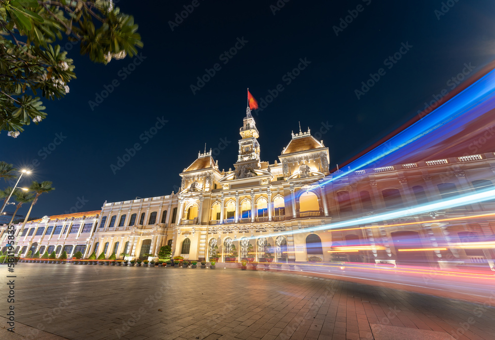 Traffic in front of Ho Chi Minh City Hall, Saigon City Hall or Committee Head office in the evening, Vietnam. Light trail and night. Popular place to visit in Saigon