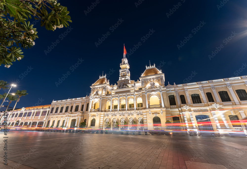 Traffic in front of Ho Chi Minh City Hall, Saigon City Hall or Committee Head office in the evening, Vietnam. Light trail and night. Popular place to visit in Saigon