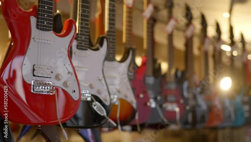 a lot of vintage electric guitars in the interior of a music store