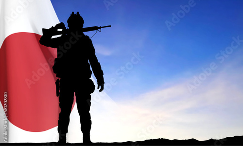 Silhouette of a soldier on background of sunset with Japan flag. Japan Armed Force Concept. EPS10 vector
