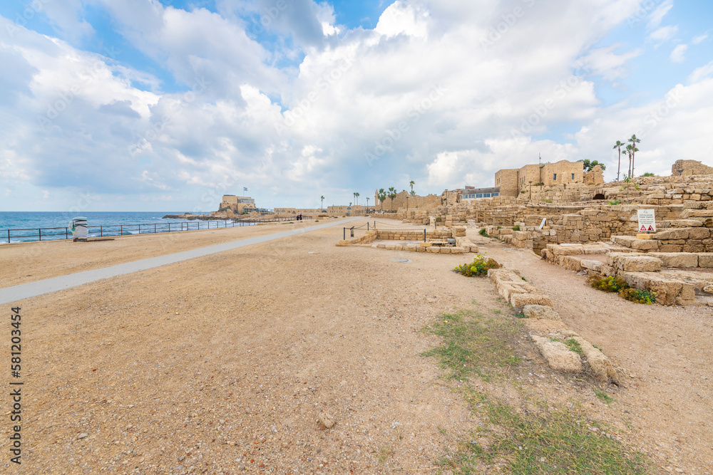 The ancient port and arena with Roman Ruins along the Mediterranean Sea at Caesarea Maritima National Park in Caesarea, Israel. The ancient port and arena with Roman Ruins along the Mediterranean Sea at Caesarea Maritima National Park in Caesarea, Israel.