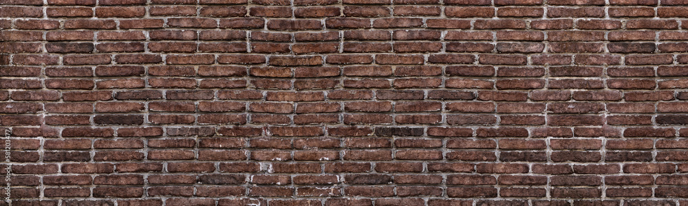 Old shabby red brick wall wide grunge texture. Aged rough brickwork panoramic background Old shabby red brick wall wide grunge texture. Aged rough brickwork panoramic background