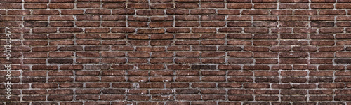 Old shabby red brick wall wide grunge texture. Aged rough brickwork panoramic background