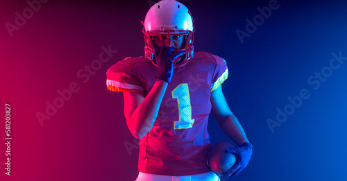 Horisontal banner for website header. Visual with American football player banner with neon colors. Template for a sports marketing with copy space. Mockup for betting advertisement.