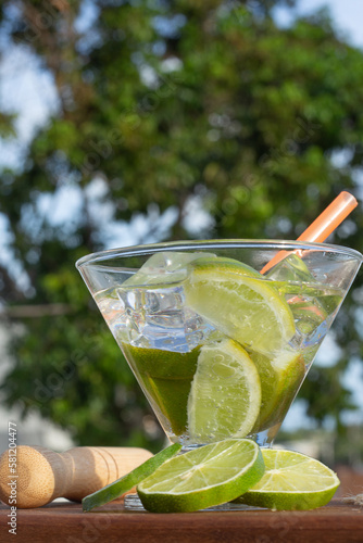 Wallpaper Mural brazilian drink (caipirinha) on the table with ingredients in a sunny day Torontodigital.ca