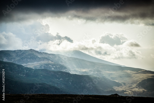 amazing panorama of heavenly lights at sunset in high mountains photo