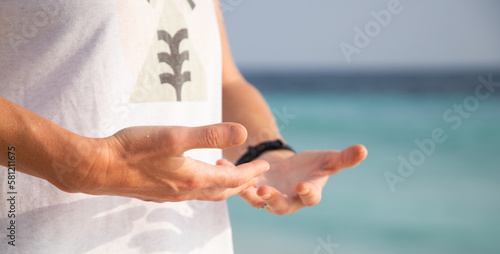 woman doing qigong on beach photo
